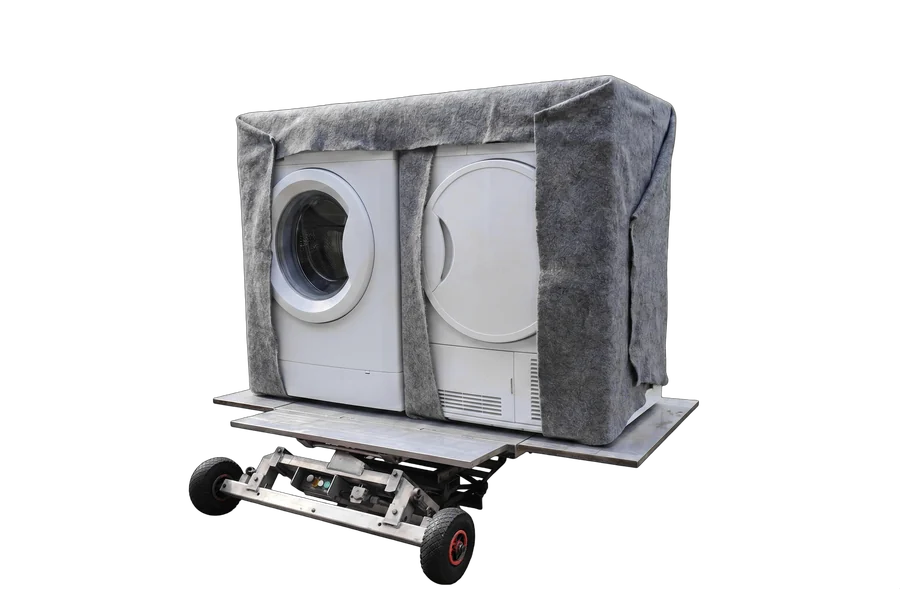 Wasmachine en droger samen op het plateau van de verhuislift